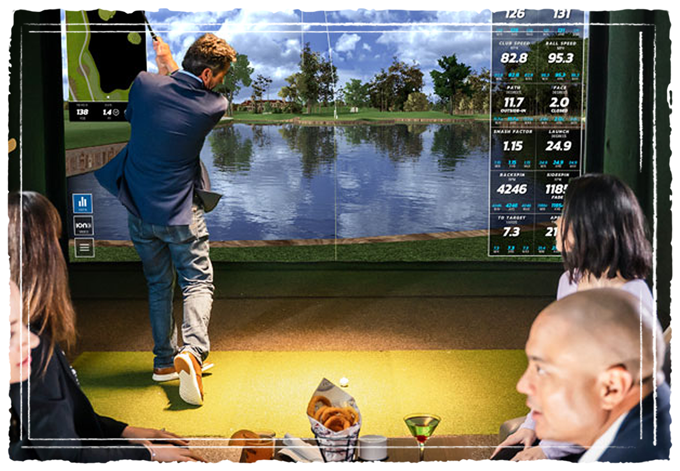 Guests in business attire playing a golf simulator at Pickle Haus while enjoying cocktails and shareable food.