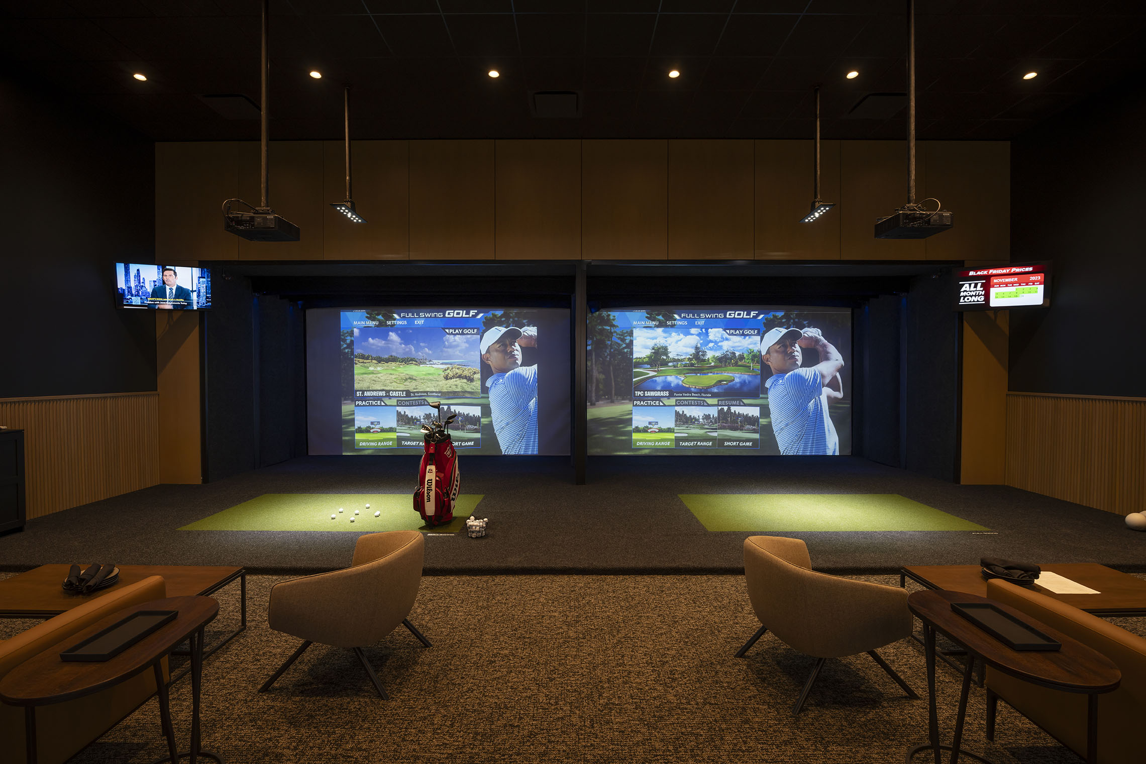 side by side empty golf simulator bays