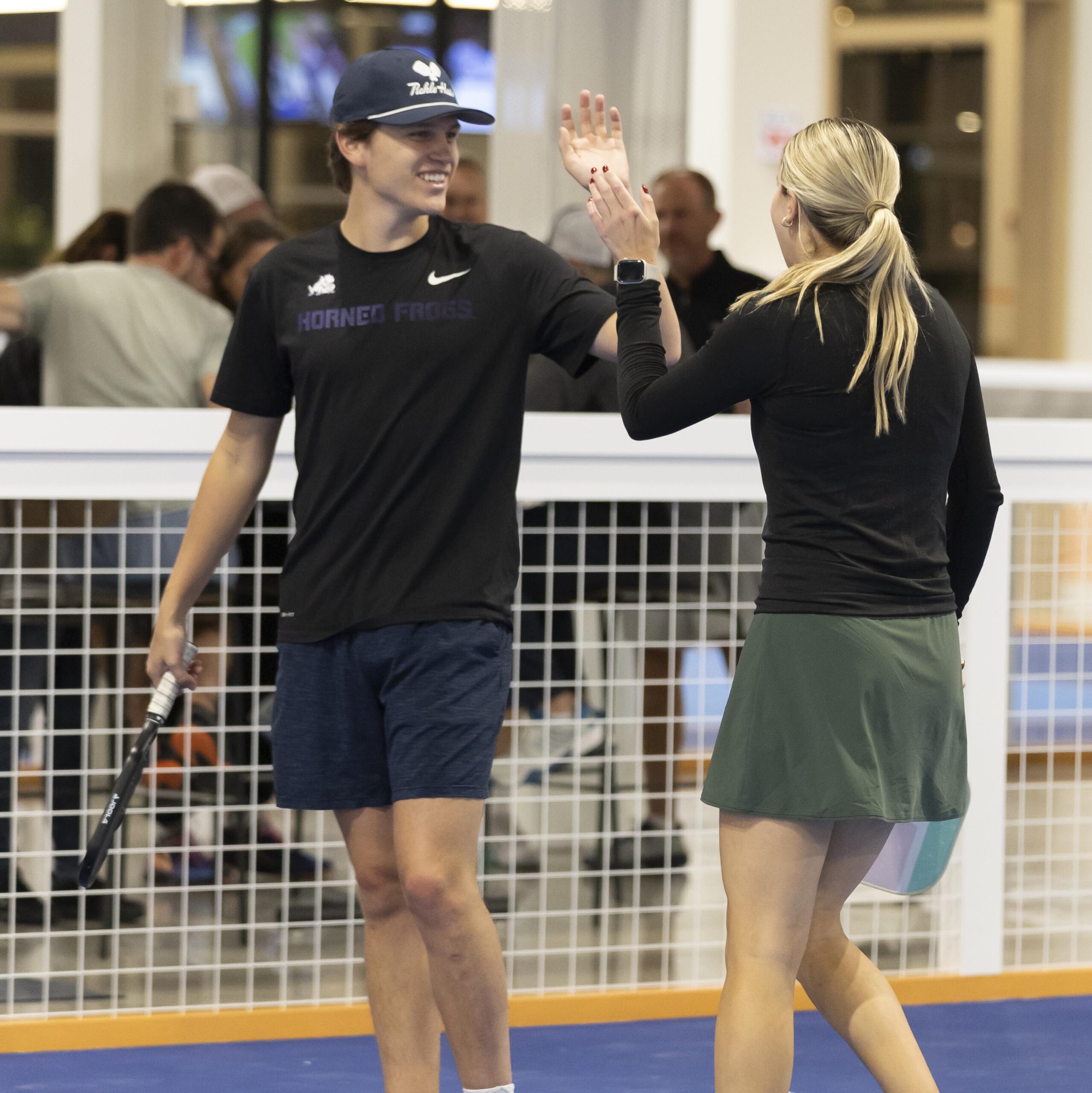 pickleball players giving a high five